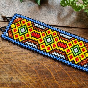 Shipibo yellow beaded bracelet from the Amazon with Ayahuasca pattern indigenous ceremonial traditional